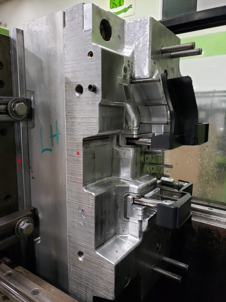 An open mold showing a newly made injection molded prototype part