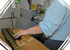 An employee working on Pad Printing