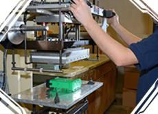 An employee works on Hot Stamping